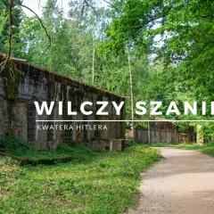 Wilczy Szaniec, dawna kwatera Hitlera, otoczony bujną zielenią. Kamienne mury porośnięte mchem i kręte ścieżki zapraszają do zwiedzania.