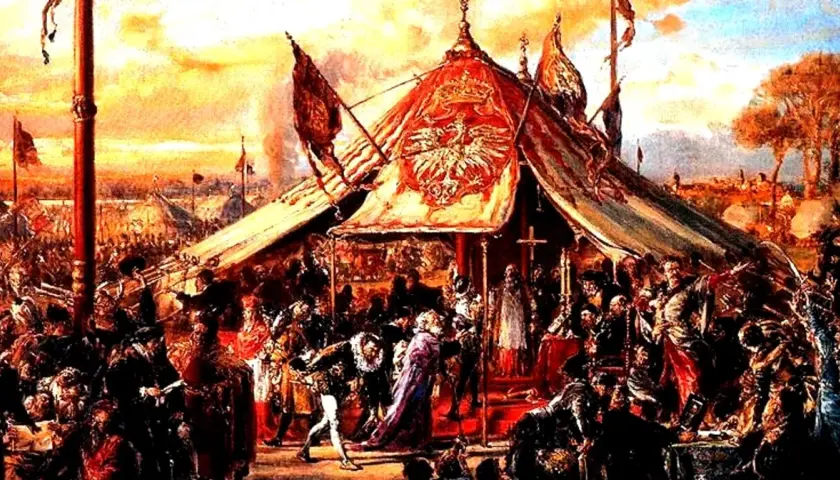 Scena historyczna z namiotem i szlachtą. W tle sztandary, symbolizujące wolność i prawo do liberum veto.