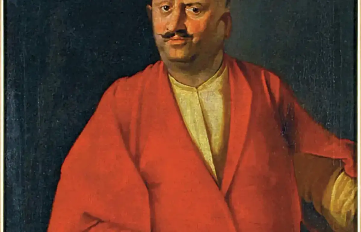 Portret szlachcica w czerwonym żupanie, jednego z sarmatów, z charakterystycznym wąsem i wschodnim nakryciem głowy.